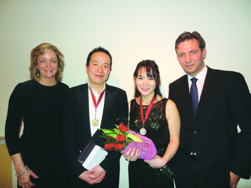 eft to right: Bonnie Barrett, Director of Yamaha Artist Services Inc., New York, with Sung Chang (first prize), EunAe Lee (second prize), and Simon Oss, Yamaha Pianos Marketing Manager.